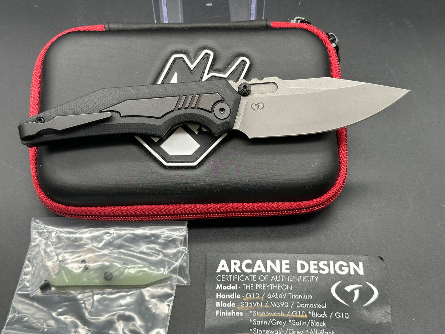 Arcane Preytheon black G10 handle w/titanium inserts w/extra jade G10 inserts included.