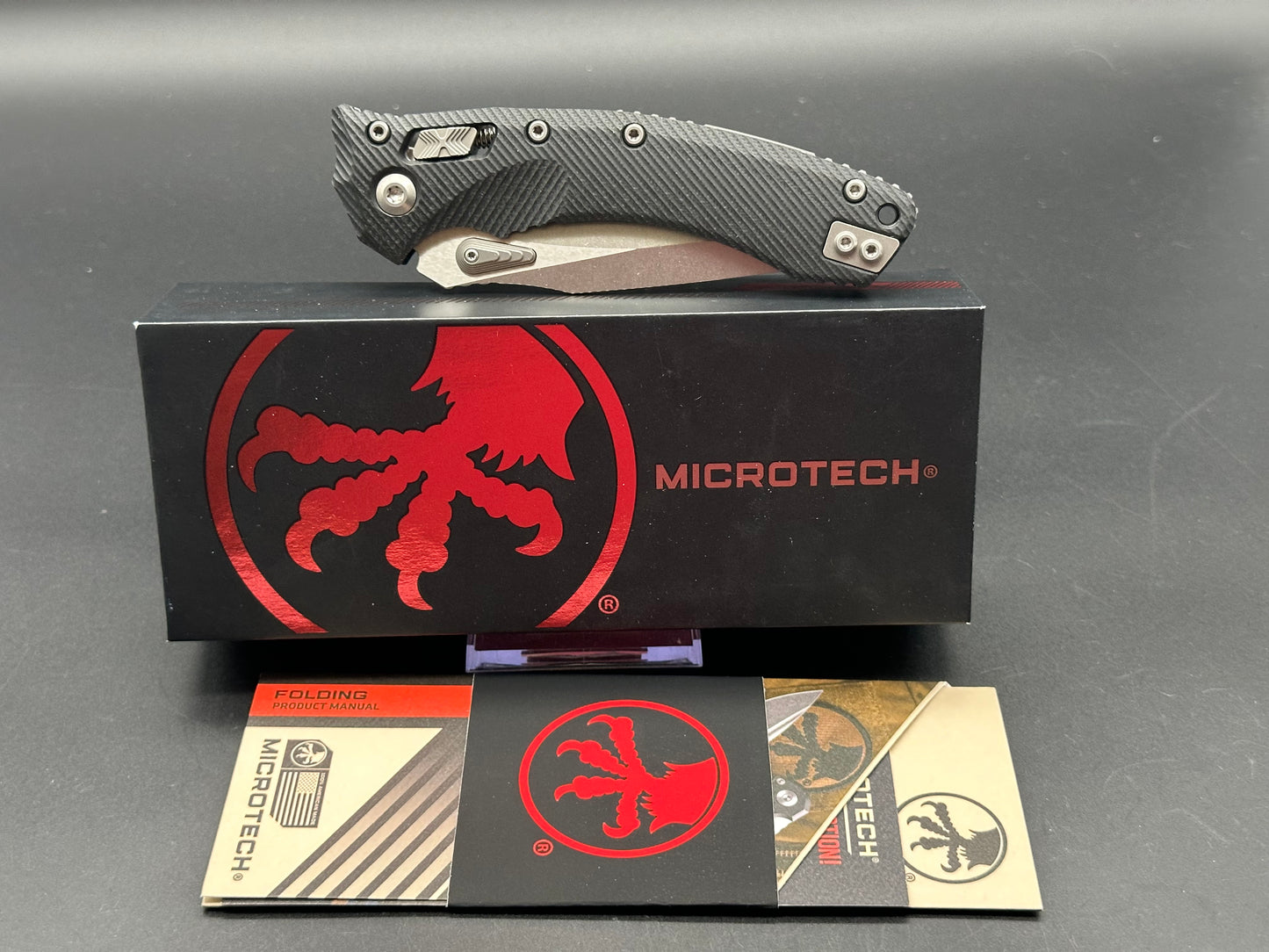 Microtech Amphibian Ram-Lok S/E Manual Knife Fluted Black G-10 (3.9" SW Serr)