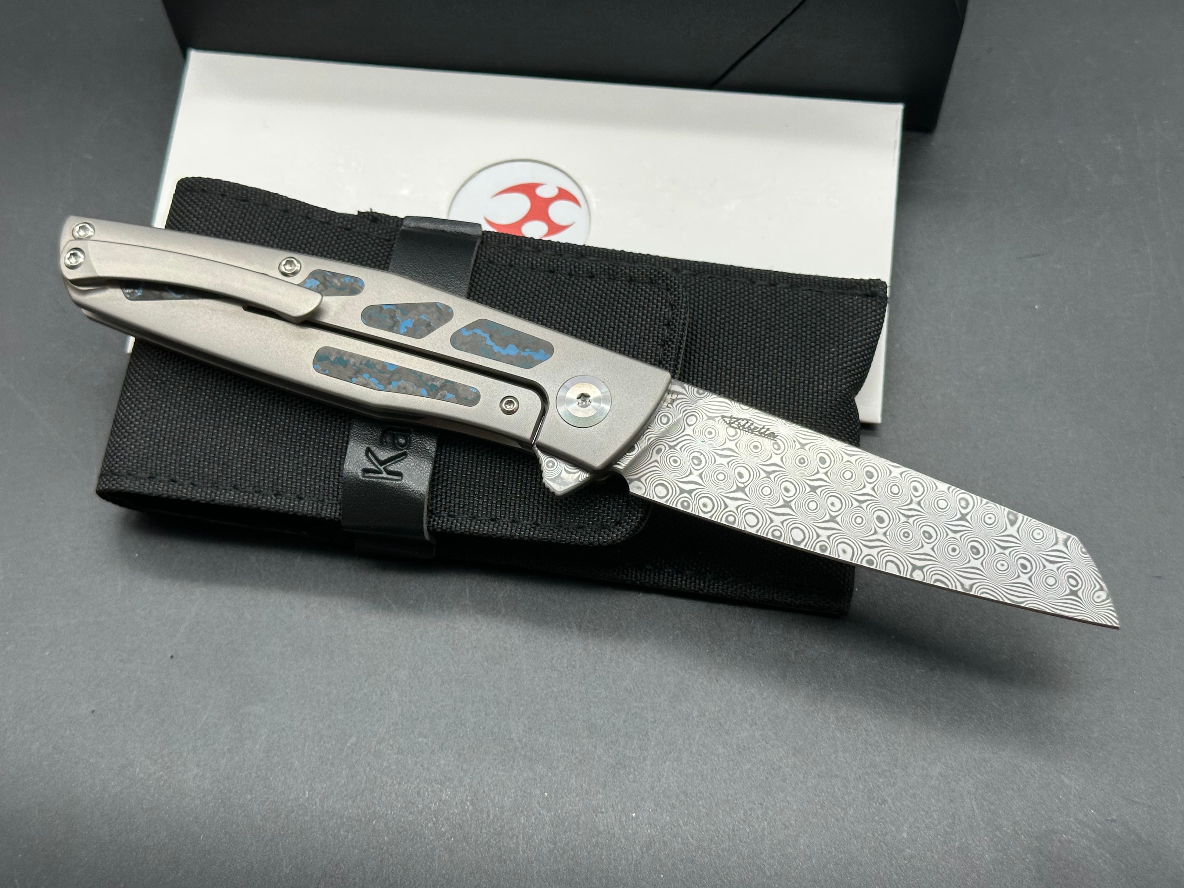 KANSEPT CRU FOLDING KNIFE TITANIUM/ARCTIC STORM FATCARBON HANDLE DAMASCUS PLAIN EDGE