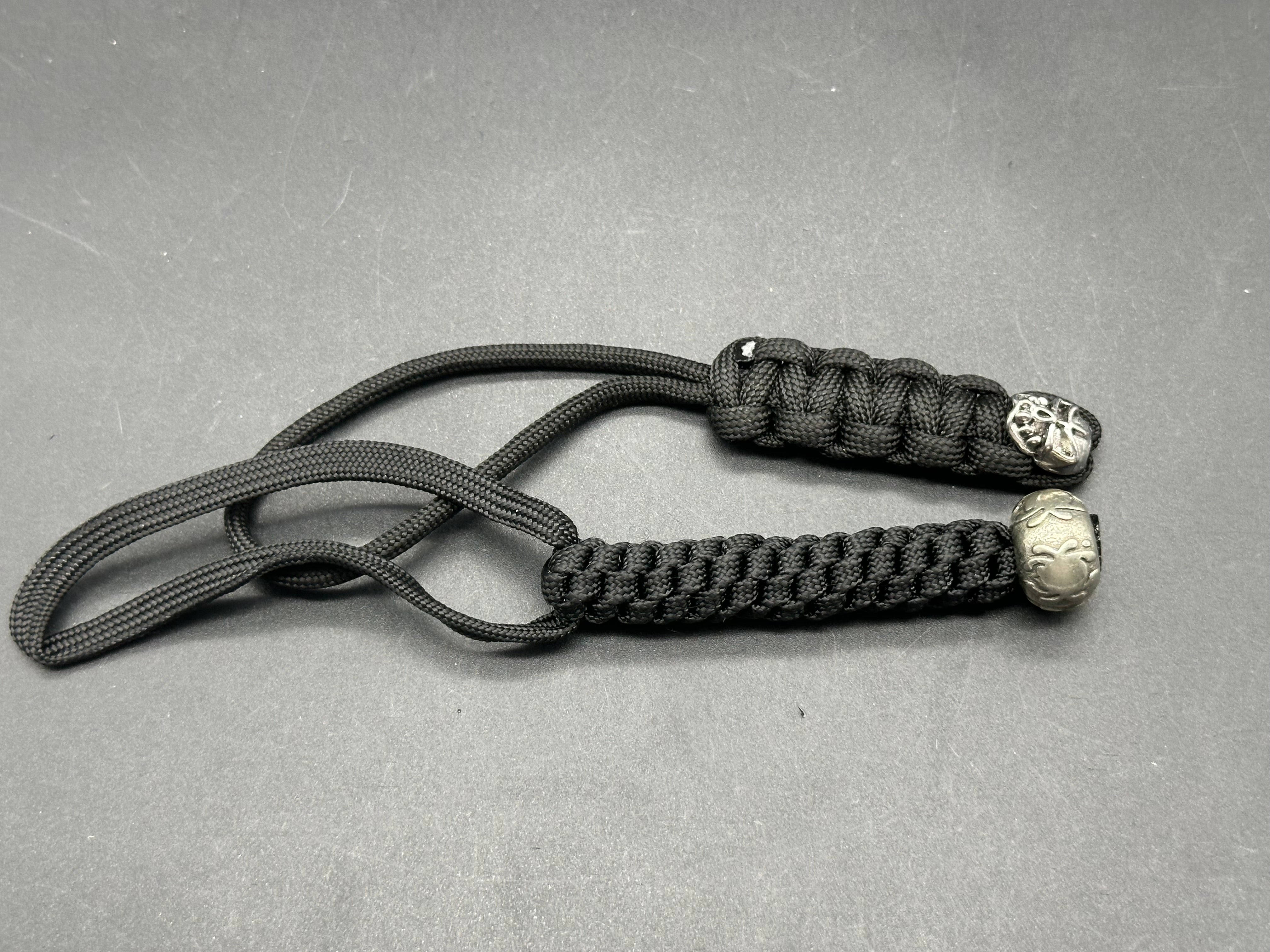 2 - paracord lanyards. Spyderco bead & skull bead